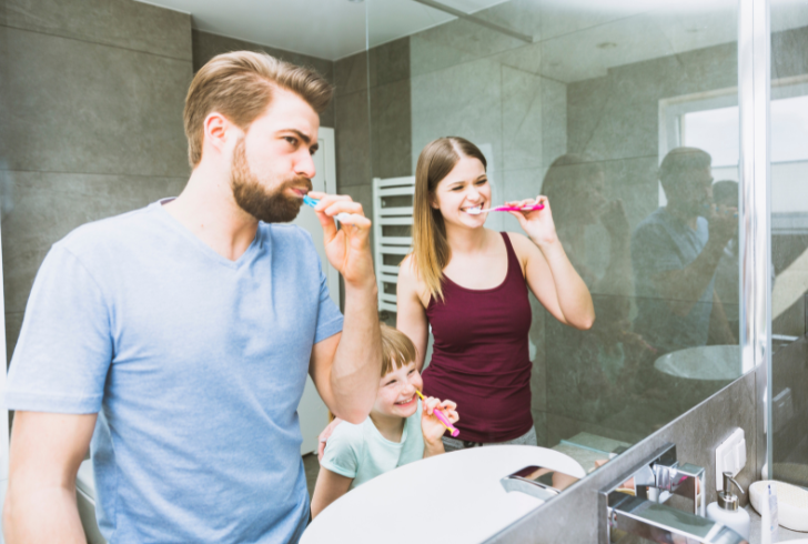 Family brushing teeth