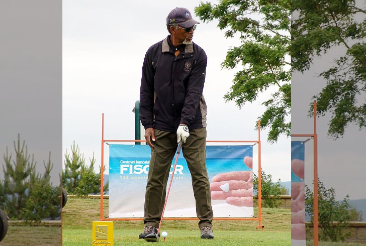 Morgan Freeman playing golf outdoors
