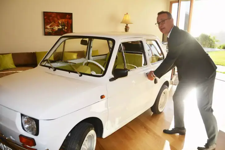 The tiny Polski Flat 126p car serves as the bright spot in Bielsko-Biala town during the country's dark years of communist rule.