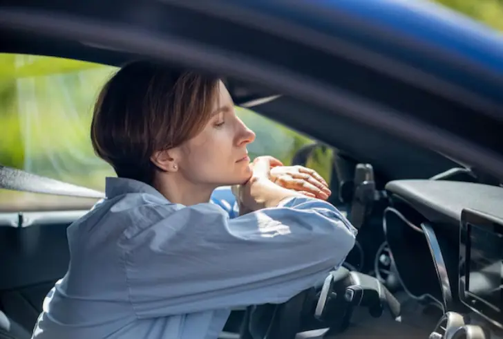 Calm driver practicing deep breathing