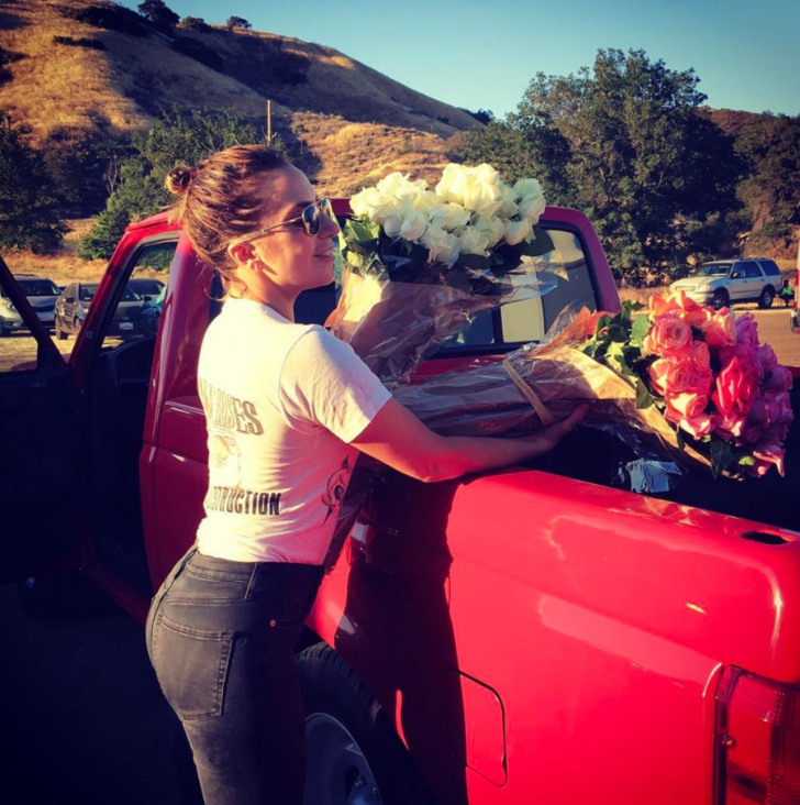 Lady Gaga shared a photo of her SVT Lightning truck while receiving flowers from producers and directors.