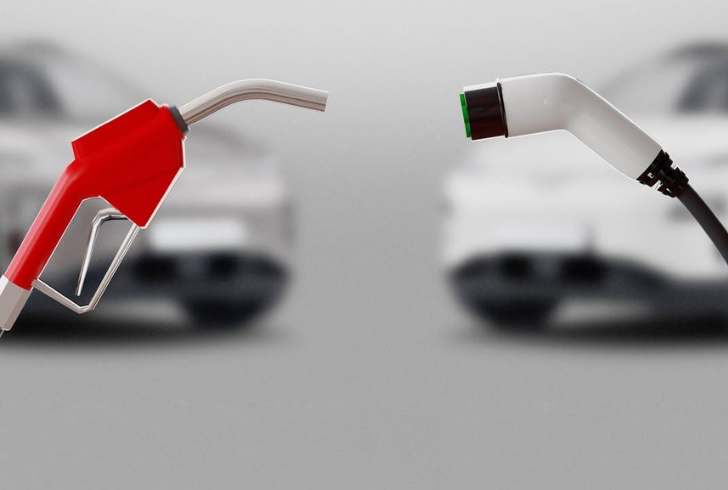 Gasoline nozzle facing electric charger