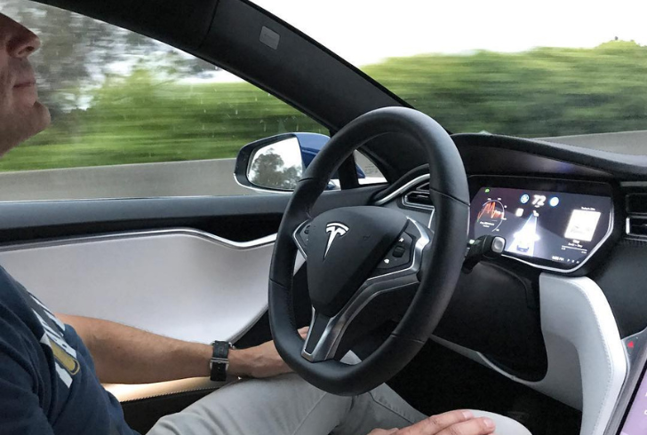 Tesla dashboard with autopilot engaged