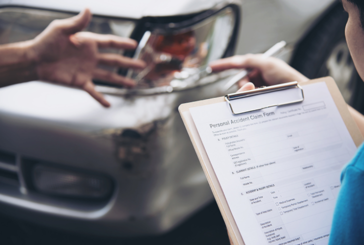 Driver discussing insurance after accident